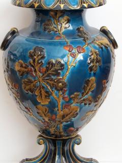 Exquisitely rendered English teal glazed ceramic urn with raised decoration - 848822