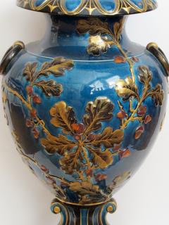 Exquisitely rendered English teal glazed ceramic urn with raised decoration - 848823