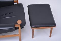 Black leather Bwana Model 152 Easy Chair with foot stool by Finn