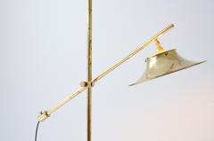Floor lamp in brass with rocker rod base and cap in shaped and perforated brass - 3335939