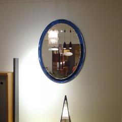 Fontana Arte An Oval Wall Mirror with a Blue Mirrored Frame in the style of Fontana Arte - 255659