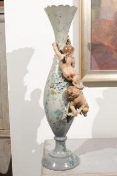 French 1870s Slender Majolica Vase with Floral D cor and High Relief Cherubs - 3420319