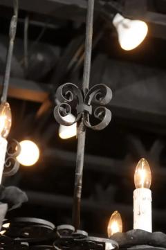 French 19th Century Black Iron Six Light Chandelier with Scrolled Motifs - 3432680