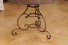 French 19th Century Round Iron Garden Table with Scrolling Base and Rusty Finish - 3555877
