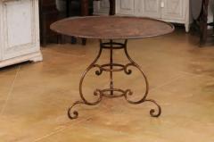 French 19th Century Round Iron Garden Table with Scrolling Base and Rusty Finish - 3555878