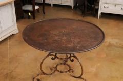 French 19th Century Round Iron Garden Table with Scrolling Base and Rusty Finish - 3555881