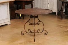 French 19th Century Round Iron Garden Table with Scrolling Base and Rusty Finish - 3555978