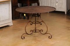 French 19th Century Round Iron Garden Table with Scrolling Base and Rusty Finish - 3555987