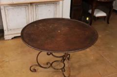 French 19th Century Round Iron Garden Table with Scrolling Base and Rusty Finish - 3556037