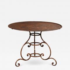 French 19th Century Round Iron Garden Table with Scrolling Base and Rusty Finish - 3560689