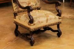 French Louis XIV Style Walnut Fauteuil with Carved Arms and Scrolling Legs - 3555817