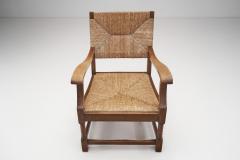 French Sculpted Oak and Paper Cord Armchairs France 1970s - 3128885