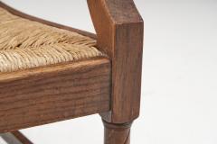 French Sculpted Oak and Paper Cord Armchairs France 1970s - 3128894