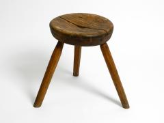 French three legged Mid Century solid wood stool with a dreamlike patina - 2525165