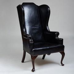 GEORGE II STYLE MAHOGANY AND BLACK LEATHER UPHOLSTERED WING CHAIR - 2011596