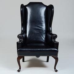 GEORGE II STYLE MAHOGANY AND BLACK LEATHER UPHOLSTERED WING CHAIR - 2011601