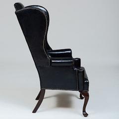 GEORGE II STYLE MAHOGANY AND BLACK LEATHER UPHOLSTERED WING CHAIR - 2011603