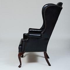 GEORGE II STYLE MAHOGANY AND BLACK LEATHER UPHOLSTERED WING CHAIR - 2011605