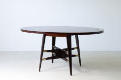 Gianni Vigorelli Elegant oval table in stained wood with four legged uprights and important cross - 3226192