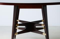 Gianni Vigorelli Elegant oval table in stained wood with four legged uprights and important cross - 3226193