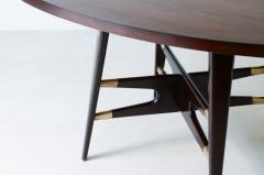 Gianni Vigorelli Elegant oval table in stained wood with four legged uprights and important cross - 3226198