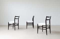 Gio Ponti Rare set of 12 chairs in anthracite stained wood with fabric covering  - 3732319