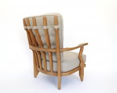 Guillerme et Chambron Pair of French Guillerme et Chambron blonde Oak petite Repos Lounge Chairs - 4264907