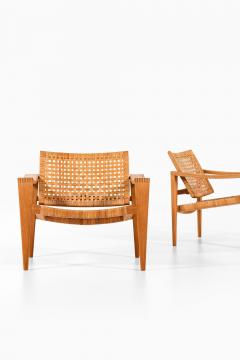 Hans Wegner Pair of Easy Chairs in Oak Woven Cane Brass and Leather by Hans Wegner 1959 - 4369838