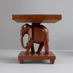 Herd of 1950s teak elephant side tables sold as pairs France - 4113497