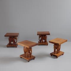 Herd of 1950s teak elephant side tables sold as pairs France - 4113500