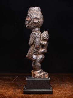 Igala scarified Maternity with infant on her back Nigeria - 4755614