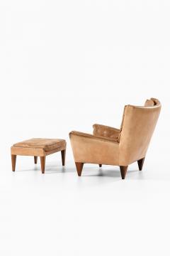Illum Wikkels Easy Chair in Leather and Rosewood with Stool by Illum Wikkels 1960s - 4507721