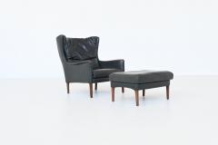 Illum Wikkelso Illum Wikkelso lounge chair and foot stool in leather Denmark 1960 - 4099040