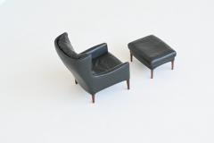 Illum Wikkelso Illum Wikkelso lounge chair and foot stool in leather Denmark 1960 - 4099044