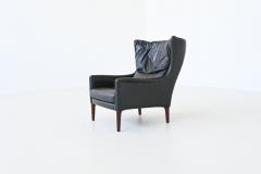 Illum Wikkelso Illum Wikkelso lounge chair and foot stool in leather Denmark 1960 - 4099046