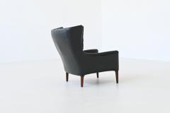 Illum Wikkelso Illum Wikkelso lounge chair and foot stool in leather Denmark 1960 - 4099048