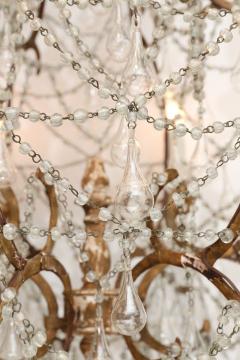 Italian Chandelier in Wood Gilt Iron and Glass - 4123095