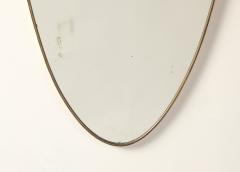 Italian Mid Century Shield Form Brass Mirror with Shell Crest circa 1950 - 4783609