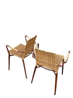 Jacques Adnet 1950s Stitched leather and rattan armchairs by Jacques ADNET - 4721172