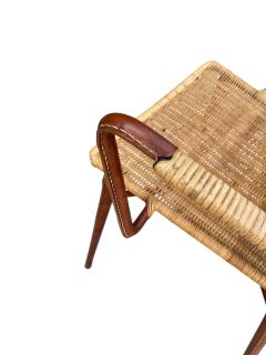 Jacques Adnet 1950s Stitched leather and rattan armchairs by Jacques ADNET - 4721174