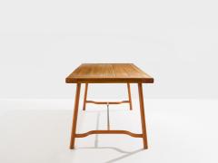 Jacques Adnet Jacques Adnet oakwood and red leather dining table 1950 - 4585891