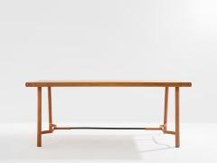Jacques Adnet Jacques Adnet oakwood and red leather dining table 1950 - 4585897