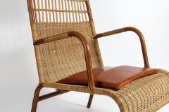 Jacques Adnet Stitched leather and rattan armchairs by Jacques Adnet - 928788