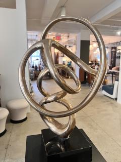 Kieff Antonio Grediaga Bronze sculpture of a twirling abstract form set on a black base - 3174812
