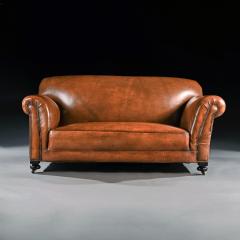 LATE VICTORIAN LEATHER UPHOLSTERED DROP ARM SOFA - 1840503