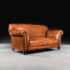 LATE VICTORIAN LEATHER UPHOLSTERED DROP ARM SOFA - 1840505