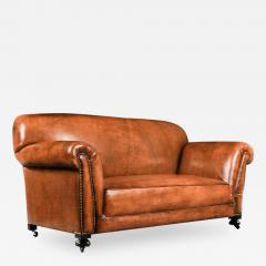LATE VICTORIAN LEATHER UPHOLSTERED DROP ARM SOFA - 1841499