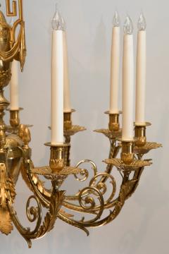 LOUIS XVI STYLE GILT BRONZE TWELVE LIGHT CHANDELIER - 696265