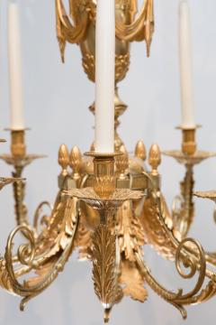 LOUIS XVI STYLE GILT BRONZE TWELVE LIGHT CHANDELIER - 696266