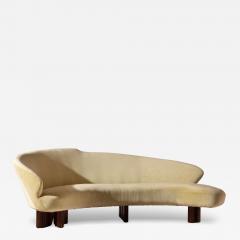 Large curved sofa with carved wooden supports Italy 1950s - 4305832